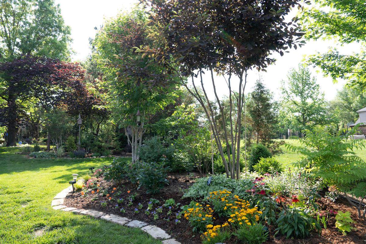 Stacy Trollinger’s backyard at 2510 N. Greenleaf Ct. is filled with more than 25 trees and a colorful variety of shrubs, plants and flowers. Her backyard and her neighbor’s yard will be on the Sedgwick County Extension’s annual garden tour.