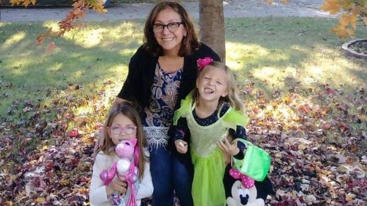Rosane Machado poses with her grandchildren. The 64-year-old died after being stabbed during a crime spree in Wichita on Dec. 4 that left her husband critically injured with stab wounds.
