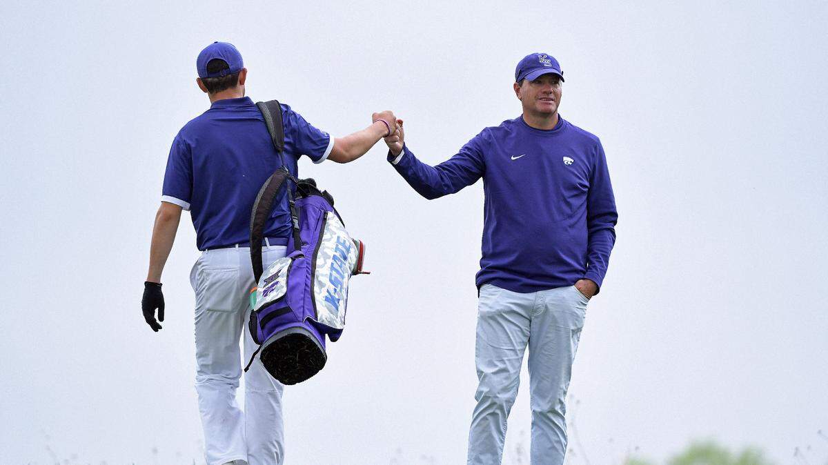 Kansas State coach Grant Robbins congratulates one of his players during the Big 12 Men’s Golf Championship at Prairie Dunes Country Club in Hutchinson on April 28, 2021.