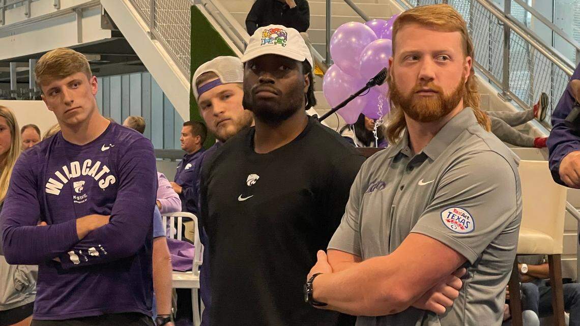 Taylor Poitier (black shirt, middle) stands alongside fellow Kansas State football players Nate Matlack (left) and Randen Plattner at a Catbacker event at Childern’s Mercy Park.