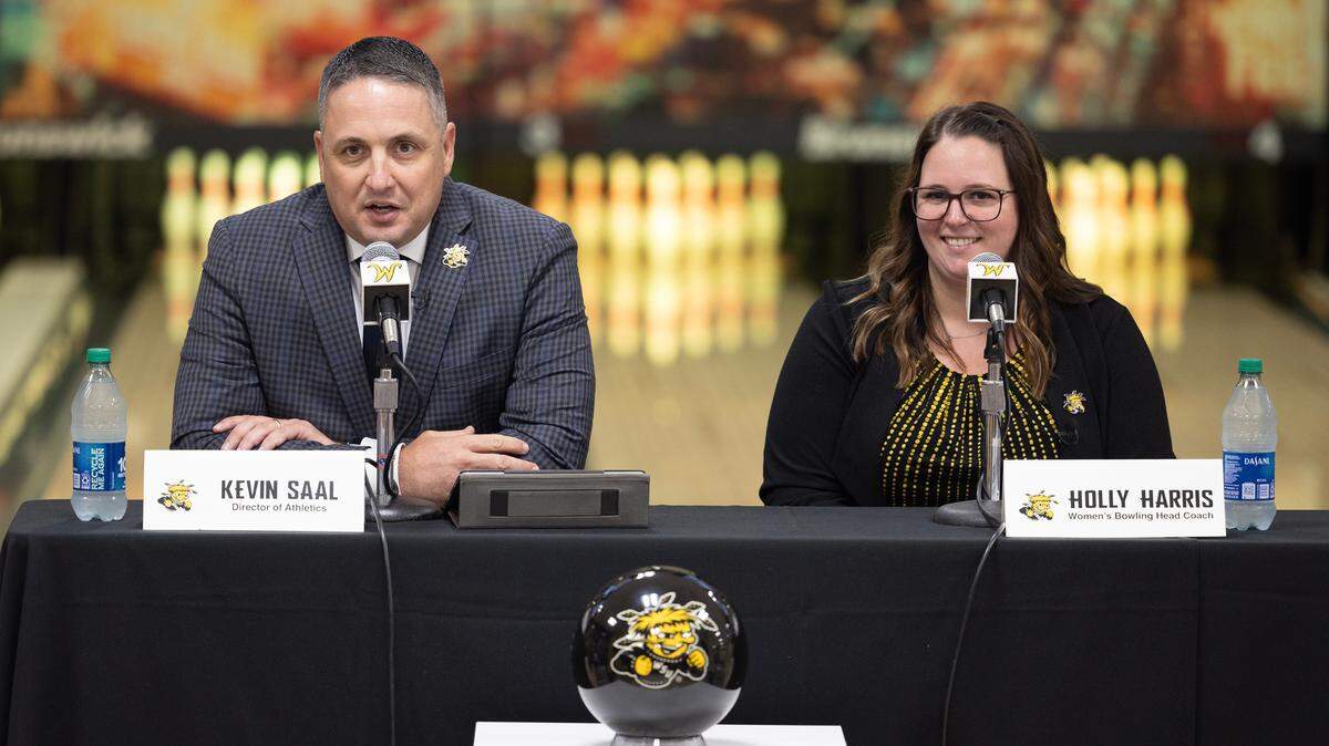 Wichita State athletic director Kevin Saal, left, and new women’s bowling coach Holly Harris announce that the team will become an NCAA-sanctioned sport starting on July 1, 2024.