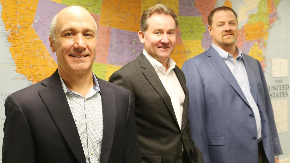 NationWide Hotel Management Co. president and COO Kevin Dailey, center, with Scott Frey, left, and Mike Rediger.