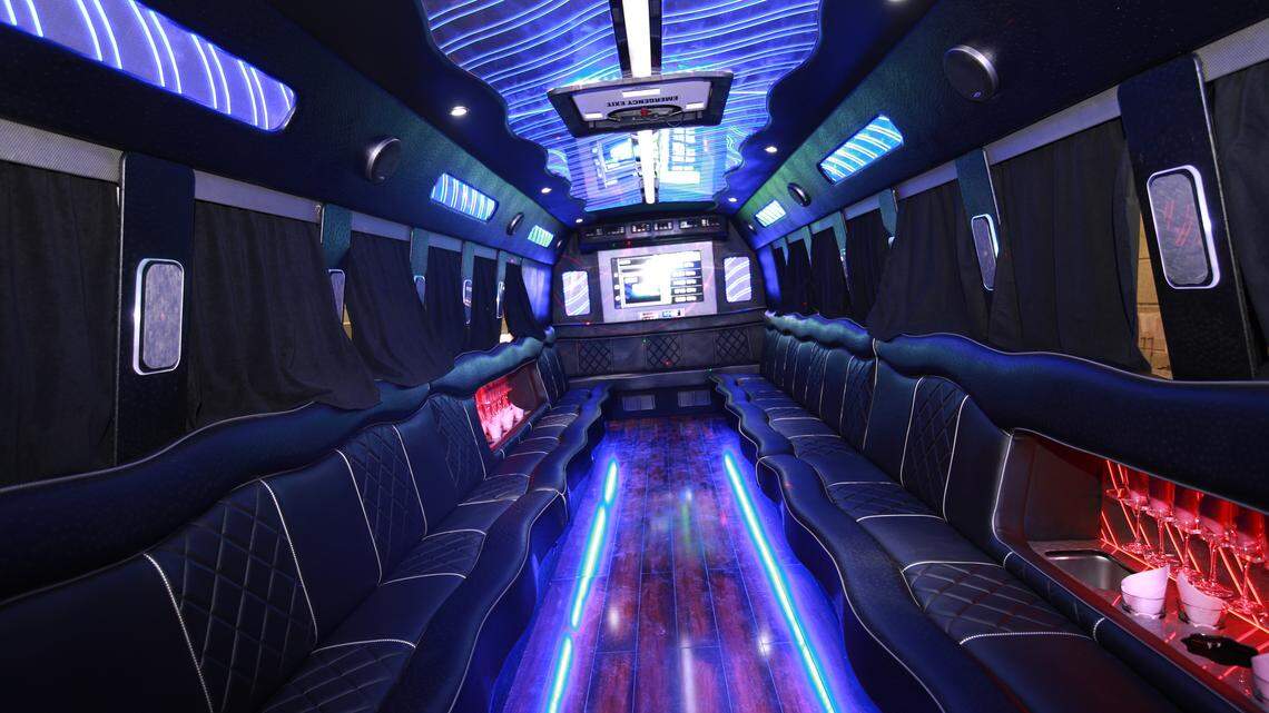 A big party bus filled with comfortable seats, and shiny bright floor for dancing and having fun.