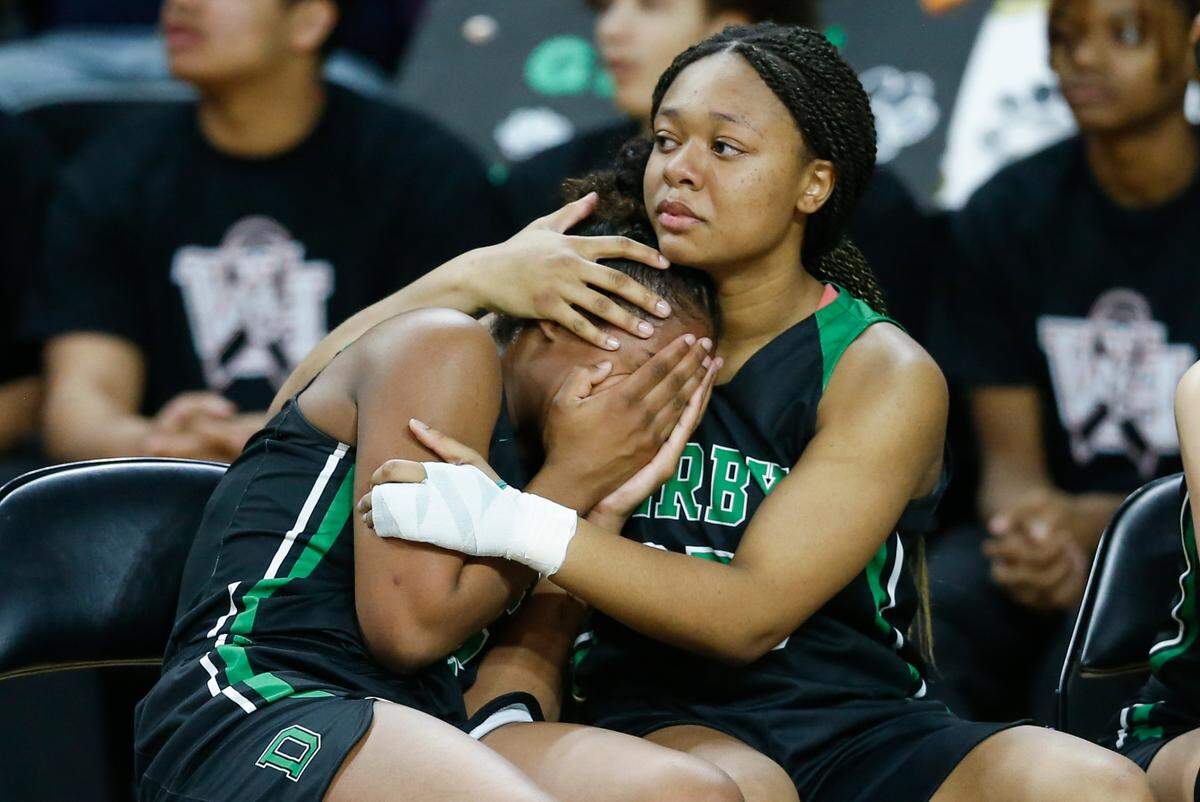 Derby’s Naomi White, right, and Jada Hopson console each other after Derby lost in the 6A Championship game to Washburn Rural on Saturday at Koch Arena.