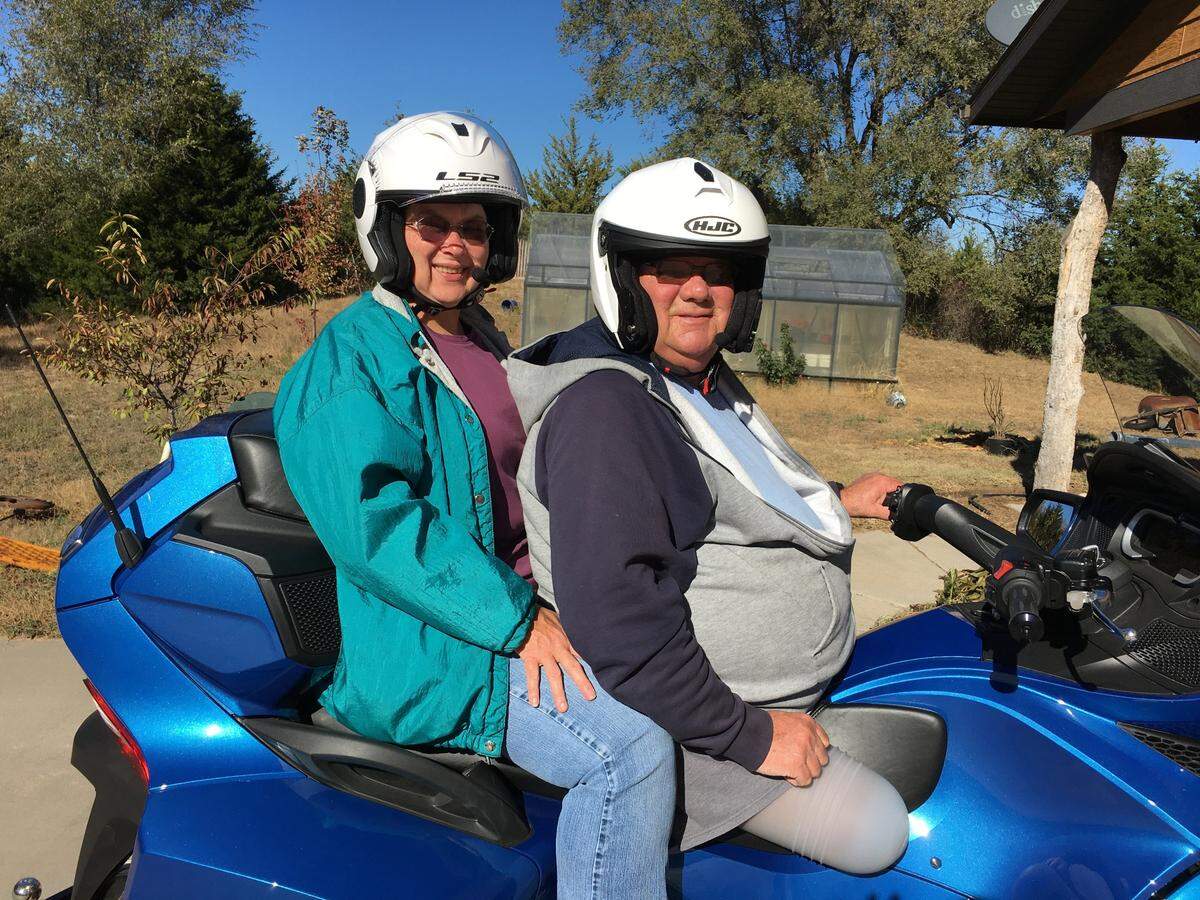 Dennis Pierson and his wife, Edith, pose for a photo before going for a ride on their motorcycle. Dennis Pierson, who was known for smiling and waving at people driving by his home, died Tuesday.