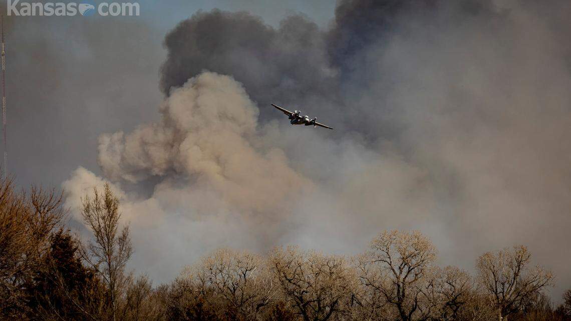 A large wildfire burns along the Reno/Harvey County line on Saturday, forcing people to evacuate certain areas.