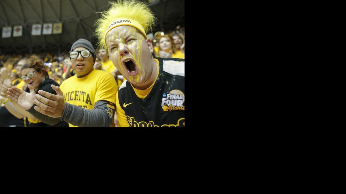 Wichita State fan Braden Pelischek cheers as the Shockers take the floor before their game against Evansville at Koch Arena earlier this season.

