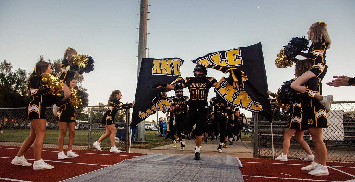 The Andale Indians run onto the field prior to the game against Wichita Collegiate at Andale High. (Oct. 7, 2016)