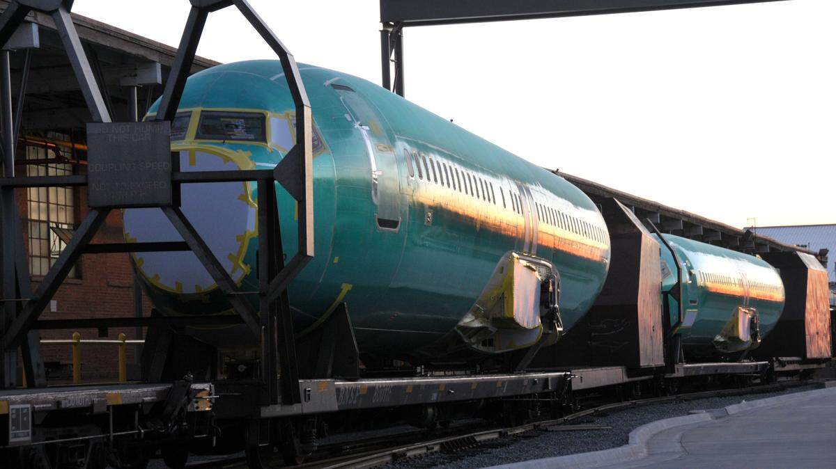 Boeing 737 fuselages manufactured by Spirit AeroSystems sit on train cars outside the company's Wichita plant awaiting delivery to Boeing's final assembly plant in Renton, Wash.