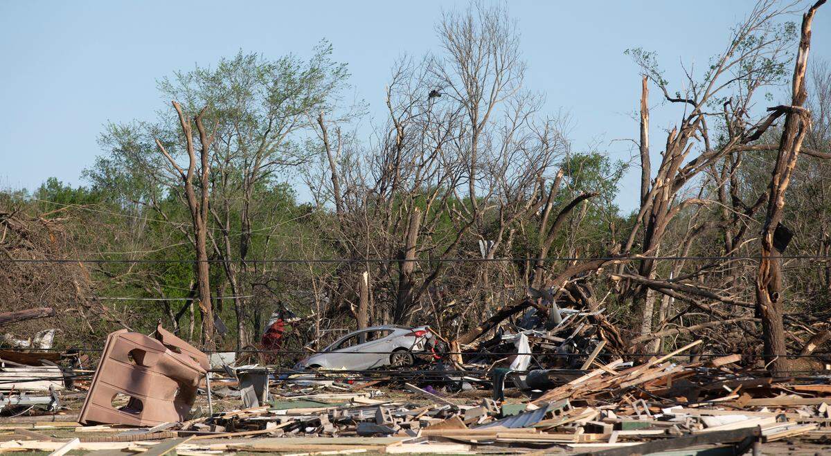 Wichita firefighters search whatÕs left of JohnÕs Animal World after a tornado hit it on April 29, 2022. This building is directly north of the Andover YMCA. (April 30, 2022)