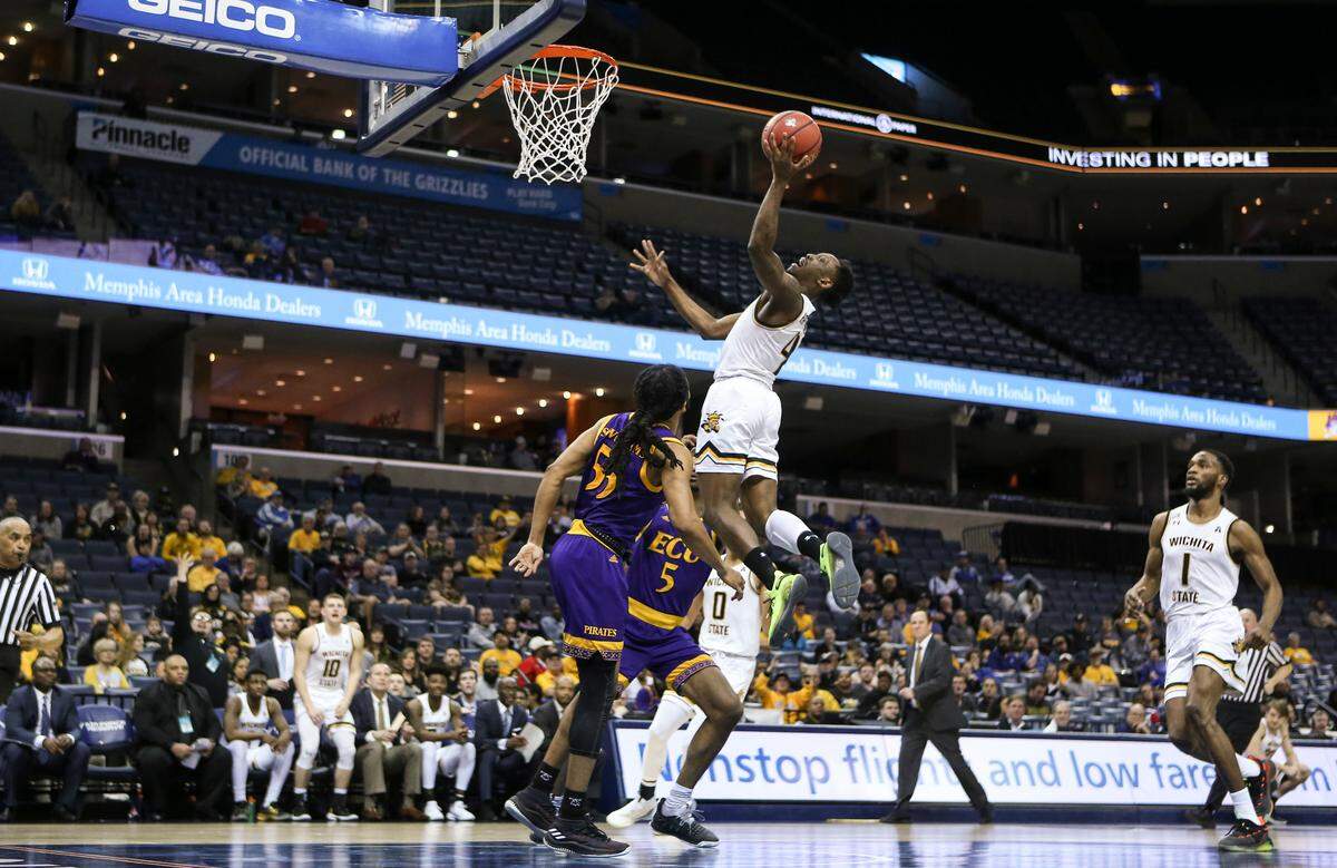 Wichita State guard Samajae Haynes-Jones goes to the basket against East Carolina guard Shawn Williams during the second half of their game in Memphis on Thursday.