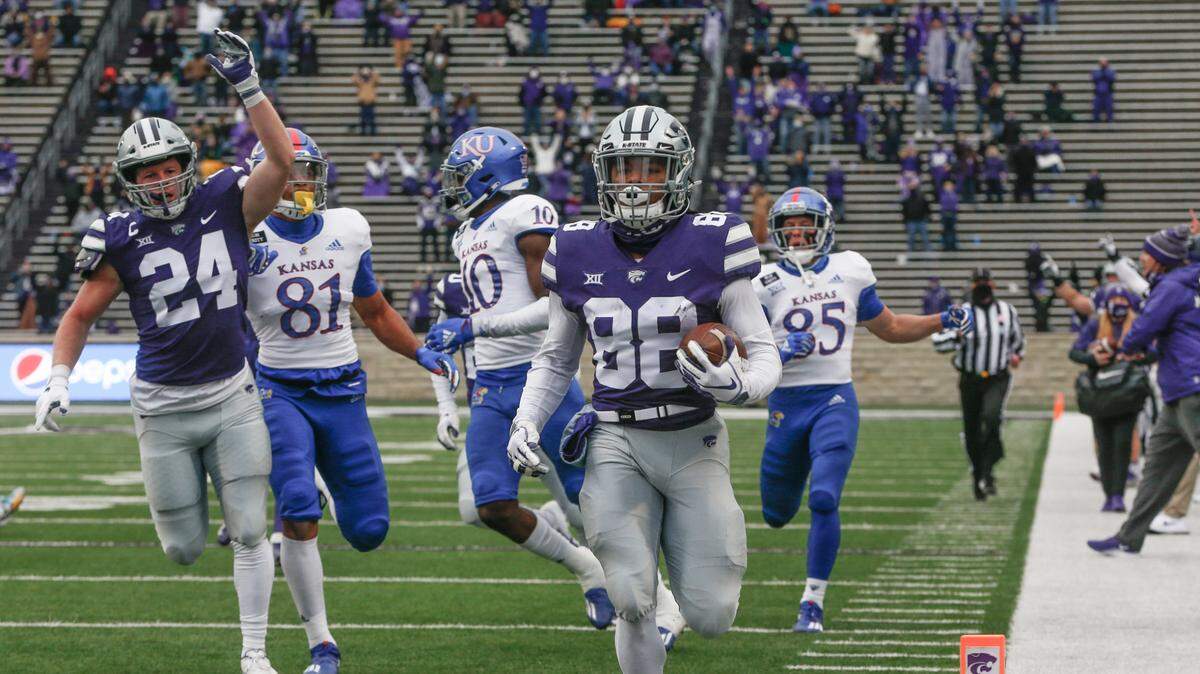 Kansas State’s Phillip Brooks runs back the first of two punt returns for touchdowns on Saturday against Kansas.