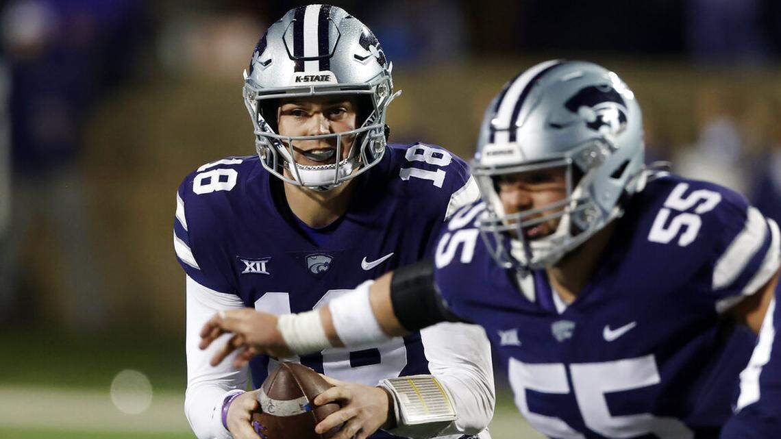 Kansas State quarterback Will Howard (18) takes the snap during the second half of an NCAA college football game against Kansas on Saturday, Nov. 26, 2022, in Manhattan, Kan. (AP Photo/Colin E. Braley)