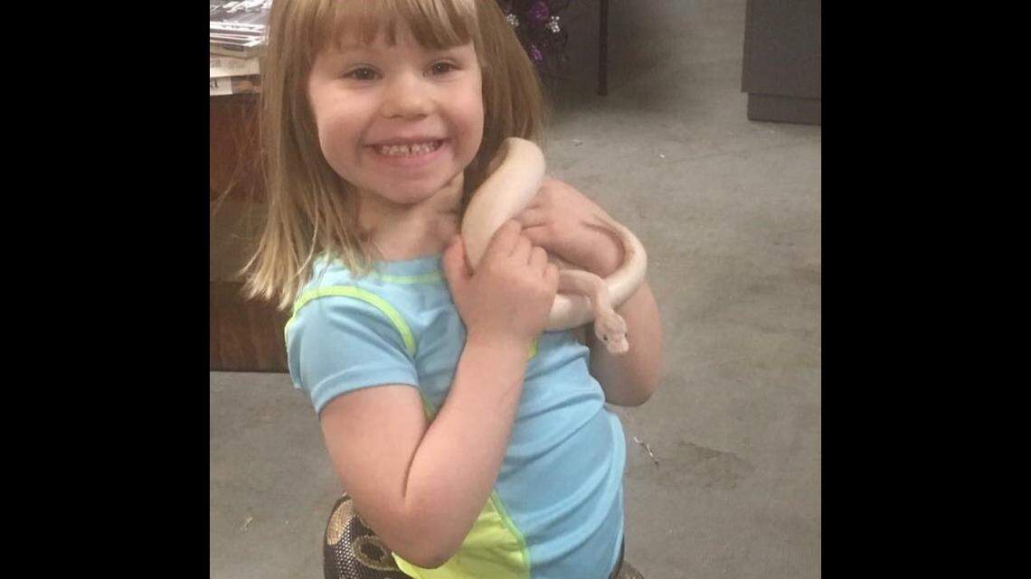 Runaway the snake now has a forever home with Jason Haack and his daughter, Abby.