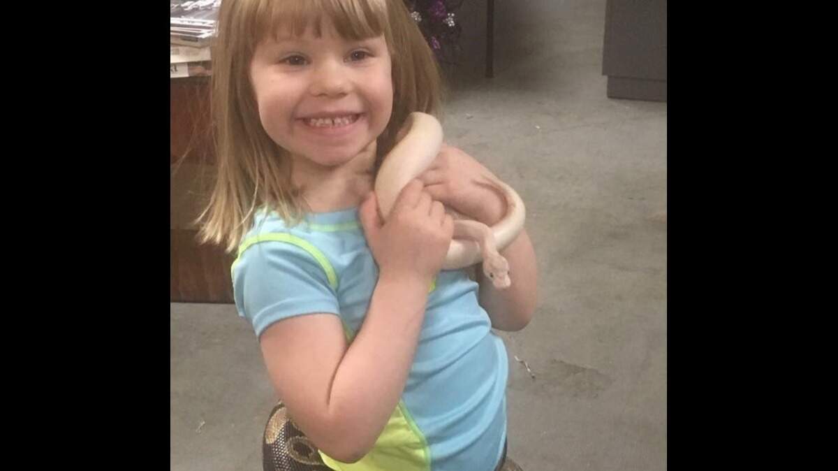 Runaway the snake now has a forever home with Jason Haack and his daughter, Abby.
