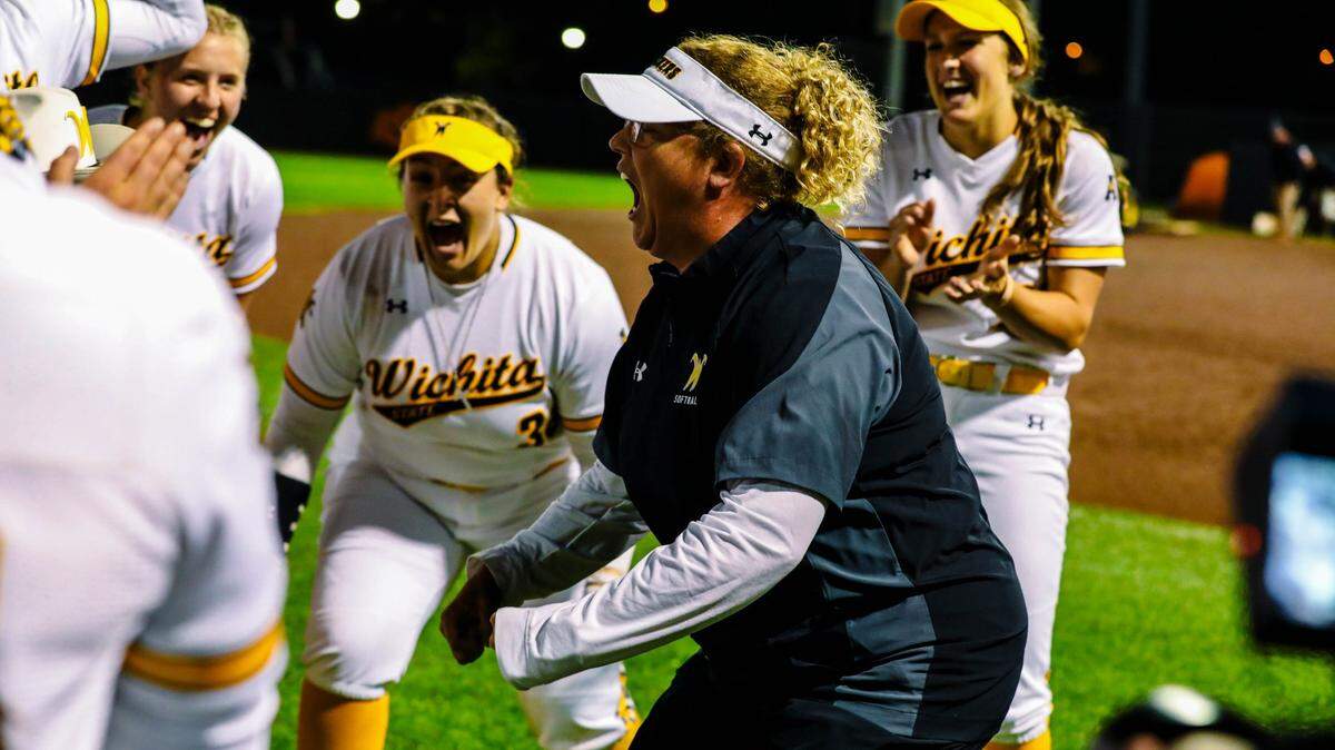 Wichita State softball coach Kristi Bredbenner celebrates the Shockers’ come-from-behind 6-5 victory over Nebraska in the opening game of the NCAA Stillwater Regional late Friday.