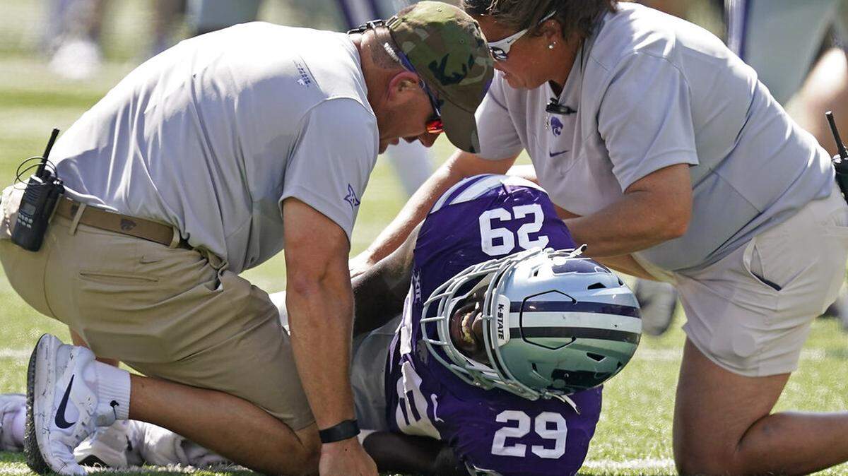 Kansas State defensive end Khalid Duke (29) is helped after being injured during the first half of an NCAA college football game against Nevada Saturday, Sept. 18, 2021, in Manhattan, Kan. (AP Photo/Charlie Riedel)