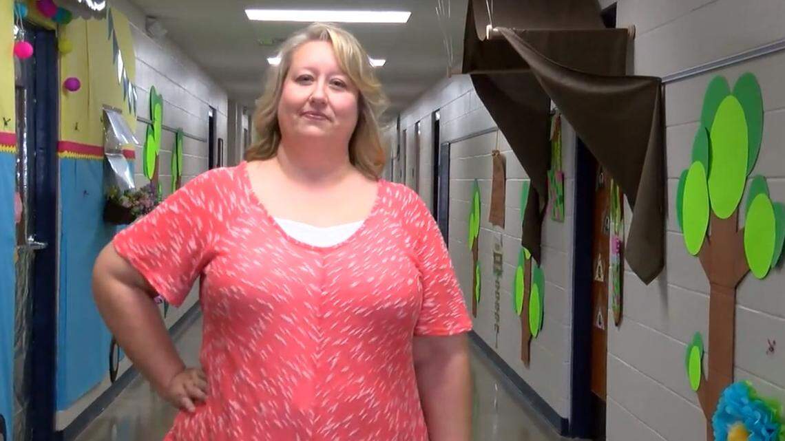 School Principal Kara Rohr used prior park ranger experience to pick up a snake in a second-grade classroom at Hector Elementary School in Arkansas.