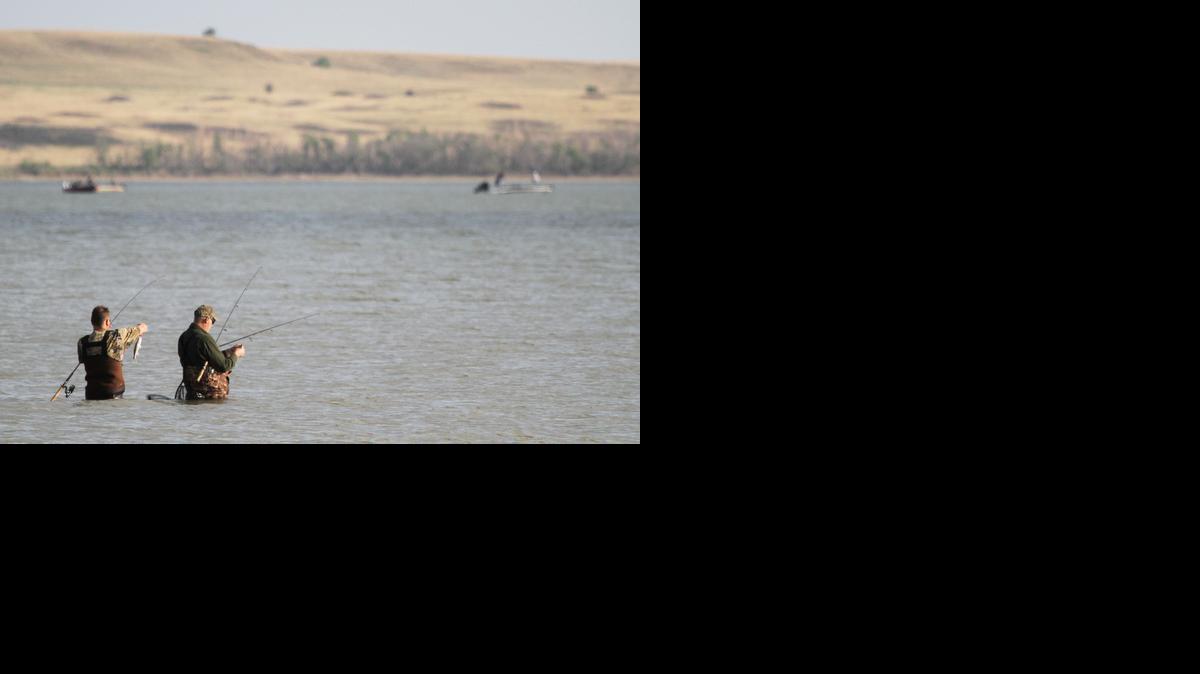 Anglers congregate to try for walleye and saugeye at Kanopolis Reservoir on Thursday afternoon. Kansas' oldest federal flood control reservoir still holds good fishing.

