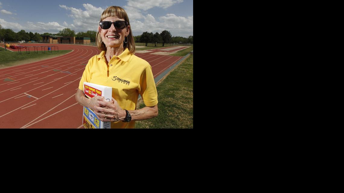 Volunteer Carol Keller coaches developmentally disabled athletes in Derby. Photographed at the Derby football field in Derby. (May 8, 2014)

