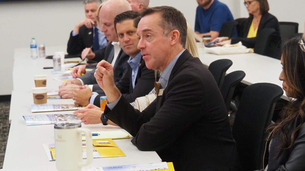 Blake Benson, chairman of the Kansas Board of Regents, says a modest $4.6 million cut in state aid to higher education may be palatable to the Kansas Legislature, which is likely to pursue greater budget austerity in the upcoming session. In this image, Benson tours the Wichita State University campus with other members of the Board of Regents in October 2024.