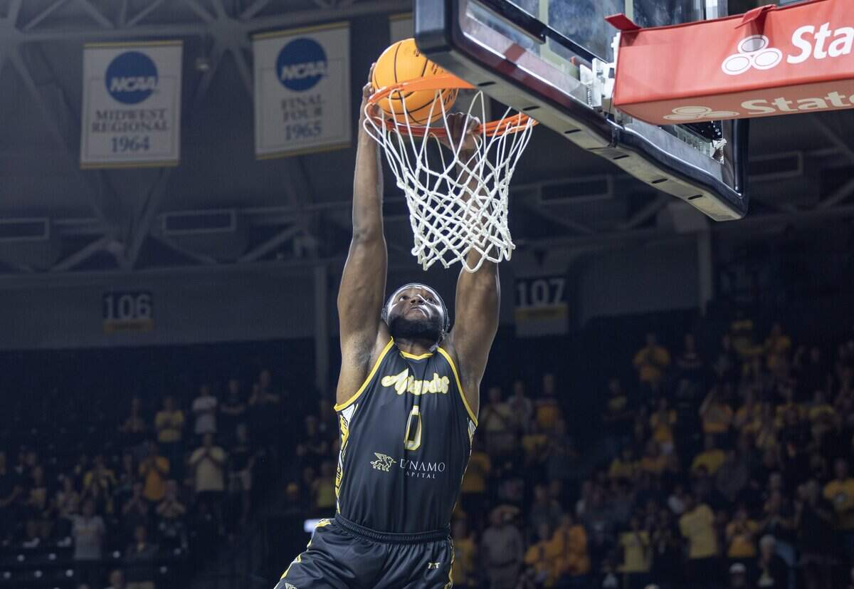 Morris Udeze dunks the ball during the first half of their opening game of the TBT tournament against The Enchantment at Koch Arena on Monday night.