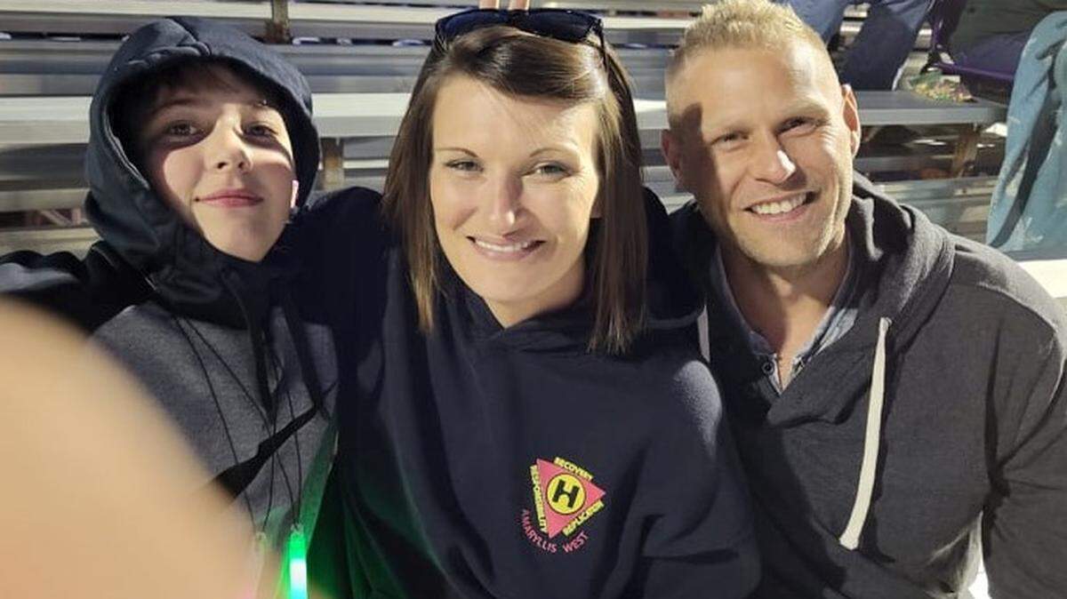 Lacy Lomax (center) lost her 13-year-old son Teagan Lomax (left) and fiance Alexander Dennis (right) in a five-vehicle wreck Friday in Reno County.