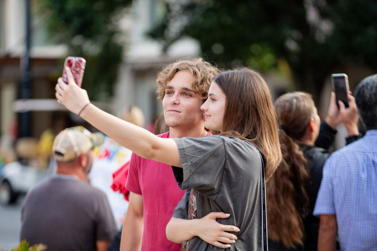 Two Riverfest attendees pose at the Star Lumber Sundown Parade.