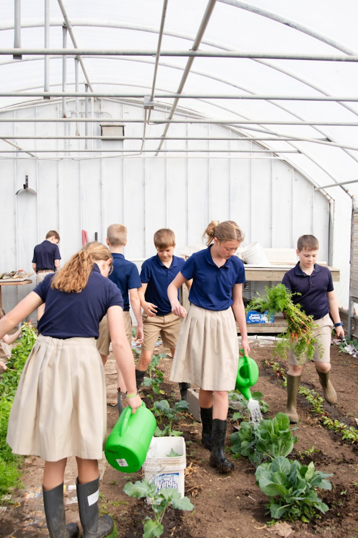 Following a capital campaign, St. John Paul II Independent Catholic School will move to the site that was formerly Eberly Farm’s west-side event venue, but it’s going to begin activities there immediately along with building a greenhouse. Students are shown here visiting one.