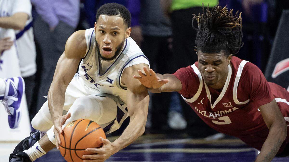 Kansas State’s Markquis Nowell dives for a loose ball against Oklahoma’s Otega Oweh during the second half on Wednesday night in Manhattan.