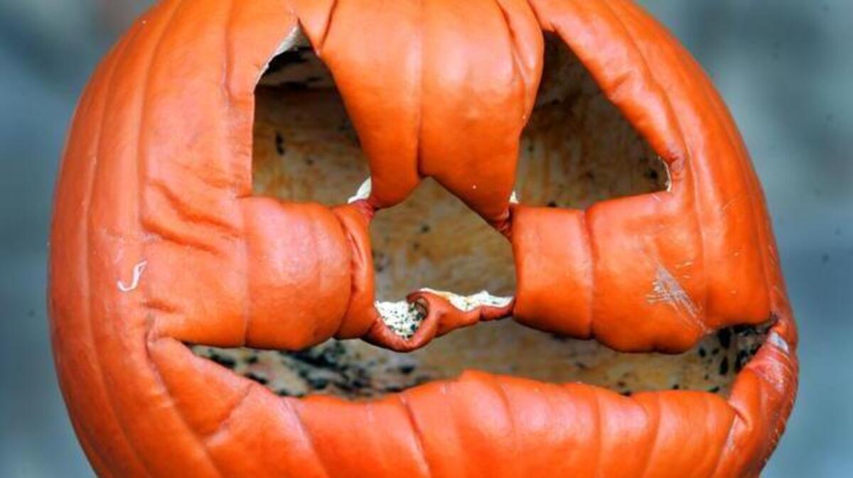 “It’s the sign that winter is here, he’s crying,” said Gear Smith Thursday of the aging pumpkin on his porch in the 2600 block of Charolotte Street. “He’s old man winter.” DAVID PULLIAM/The Kansas City Star