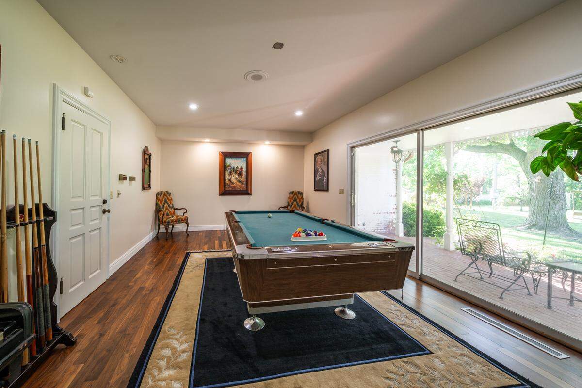 The game room opens to a patio.