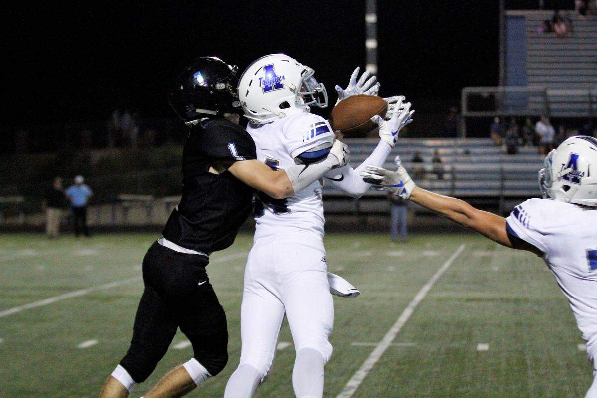 Andover sophomore cornerback Brett Albright intercepts a pass during the Trojans’ 30-22 win over Goddard Eisenhower on Thursday night. (Sept. 13, 2018)