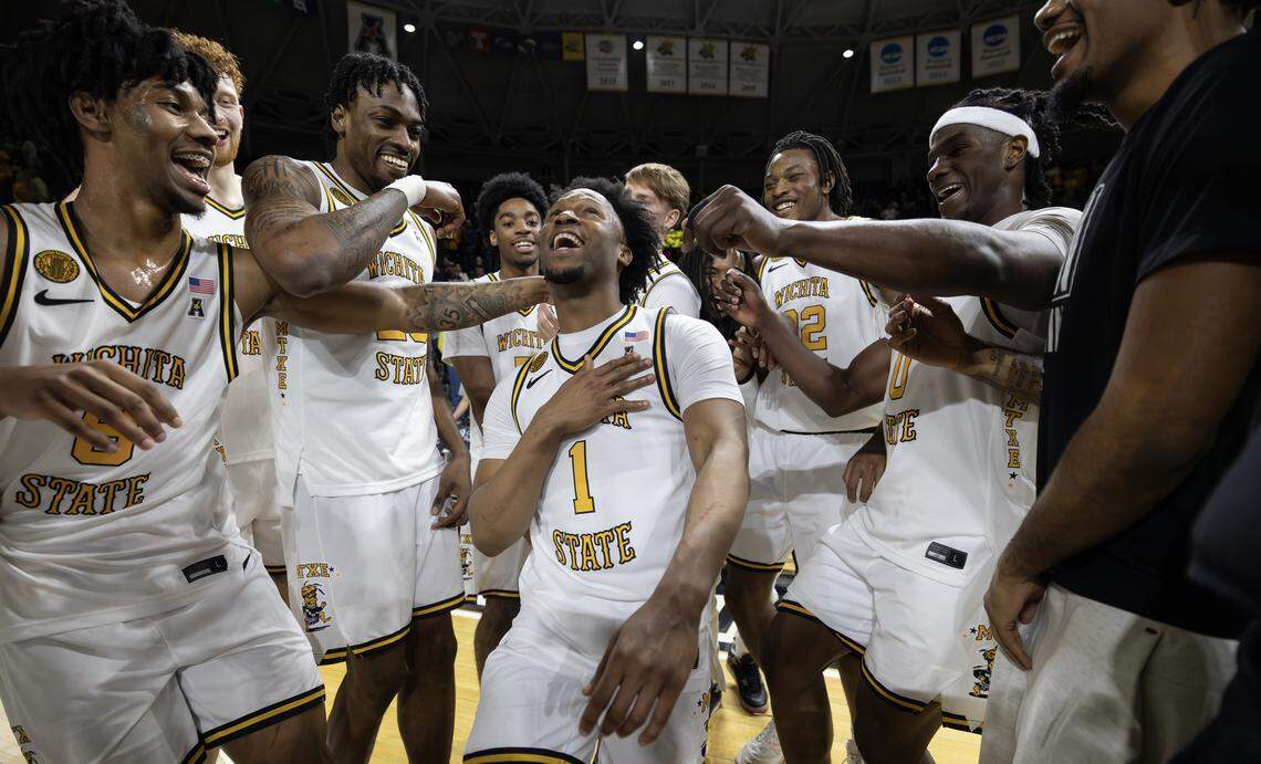 Wichita State’s Kenyon Giles dances with teammates after they defeated Florida Atlantic on Saturday at Koch Arena.