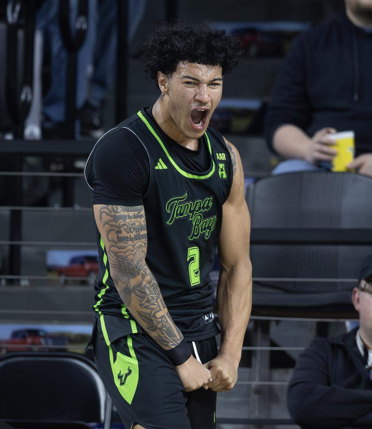 South Florida’s Wes Enis celebrates a basket and a foul during the first half against Wichita State at Koch Arena on Wednesday night.