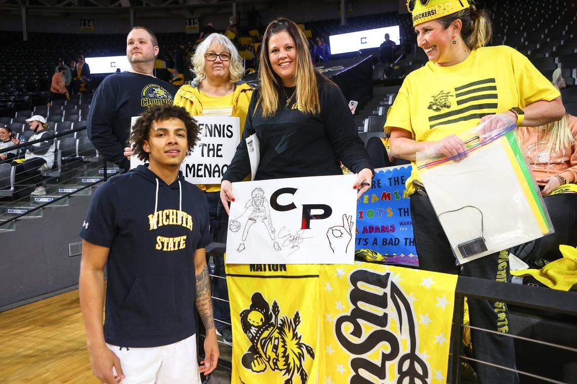 Wichita State guard Craig Porter poses with Shocker fans before a game this season. He has become a fan favorite with his dunks and blocks.