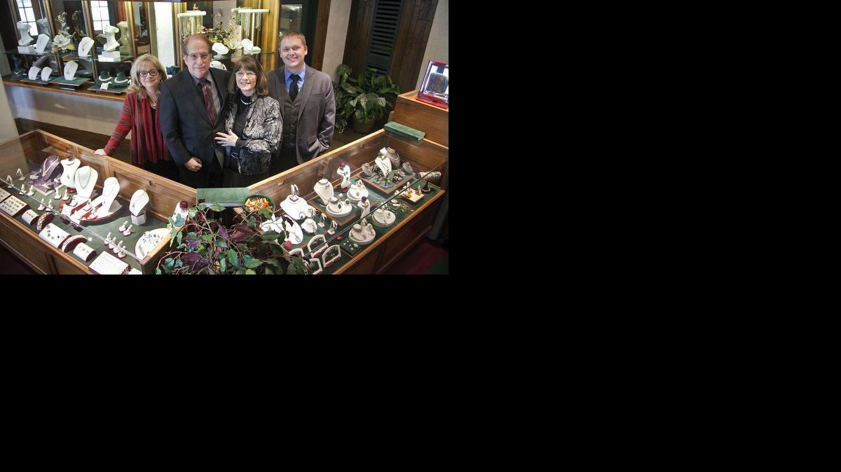 Jerry and Johnna Burnell of Burnell's Creative Gold, center, have sold the business to employees Robin Lies, left, and Nathan Regan. Jerry Burnell will continue to work there up to 20 hours a week, but he’s no longer an owner.

