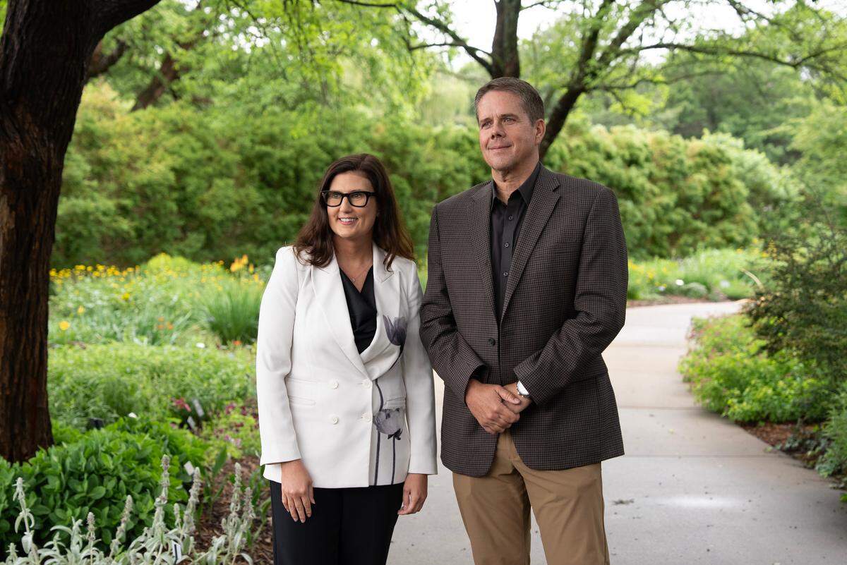 Lynette Zimmerman, executive director of Botanica, and Gary Janzen, director of public works for Wichita, wait before a press conference announcing a project to reuse water. Botanica has designed a temporary water storage and irrigation system that seeks to use over 3 million gallons of non-potable water from the new city water treatment plant’s testing process.