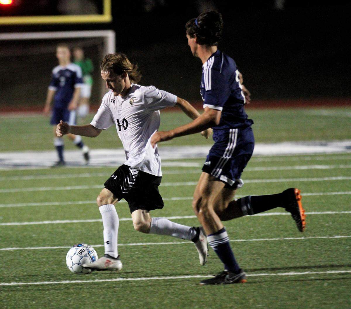 Maize South senior forward Andrew Bliss blows past his defender during the Mavericks’ 5-1 win at Trinity Academy on Friday. (Aug. 24, 2018)