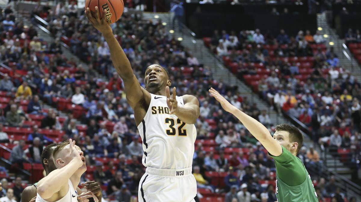 Wichita State forward Markis McDuffie shoots against Marshall during the first half of their game in the NCAA Tournament in San Diego. A clip of McDuffie was featured in this year's "One Shining Moment" video.