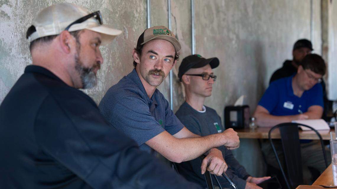 Steven Brady, center, a fourth generation family member at Brady Nursery, met with a group of Wichita nursery operators Tuesday at Wichita Brewing Company in Delano to discuss water restrictions. At the far left is Hillside Nursery president Mark McHenry, who organized the meeting.
