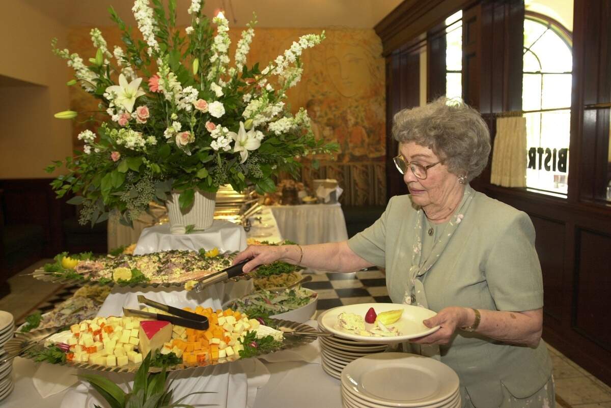 Naomi Kice samples cheese at the Olive Tree’s Sunday brunch buffet.