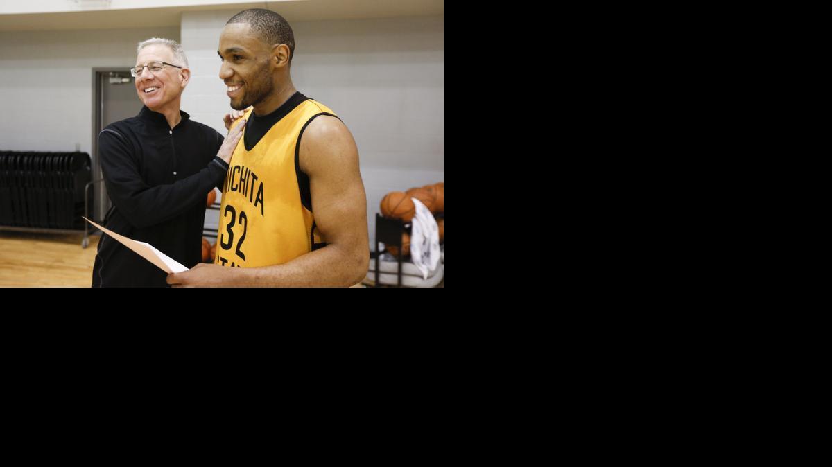 Steve Dickie laughs with Wichita State junior Tekele Cotton after a recent practice. Dickie is the team's character coach, working with the players' mental side on and off the court.