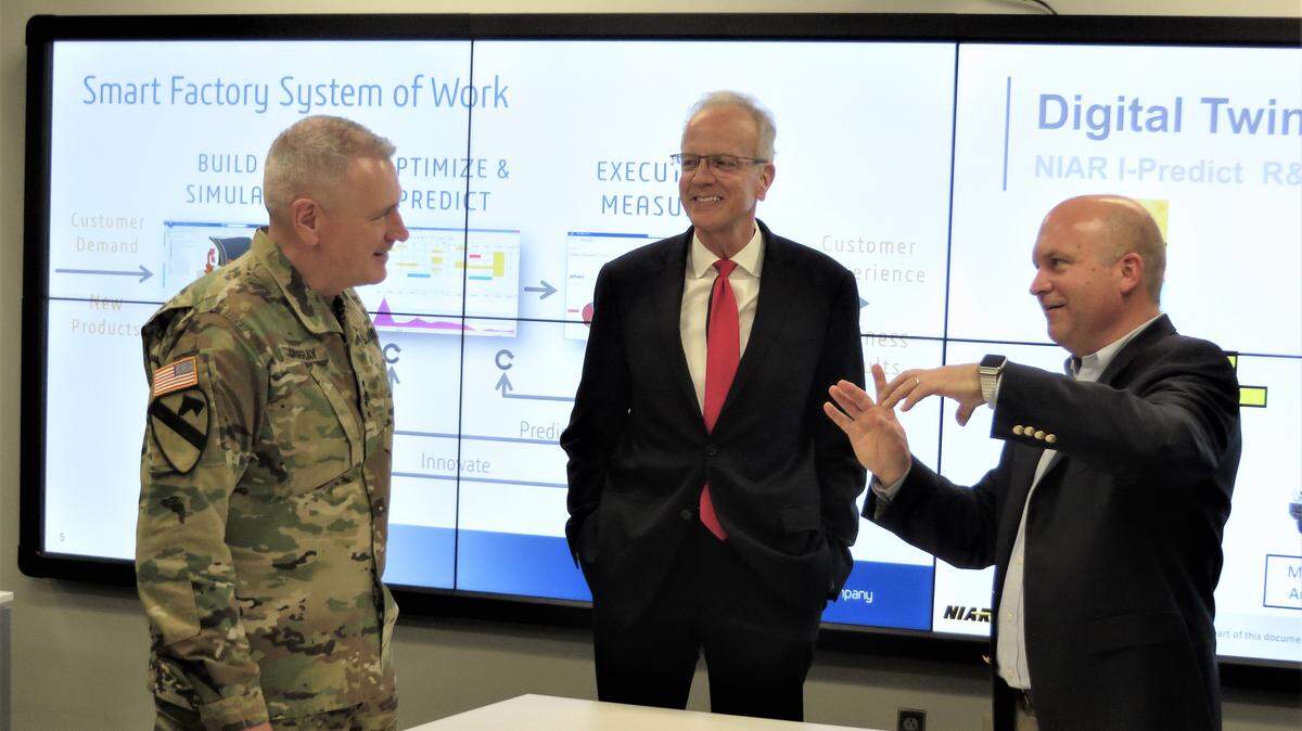 NIAR Executive Director John Tomblin, right, discusses military applications of digital twin technology with General John M. “Mike” Murray, left, and Sen. Jerry Moran.