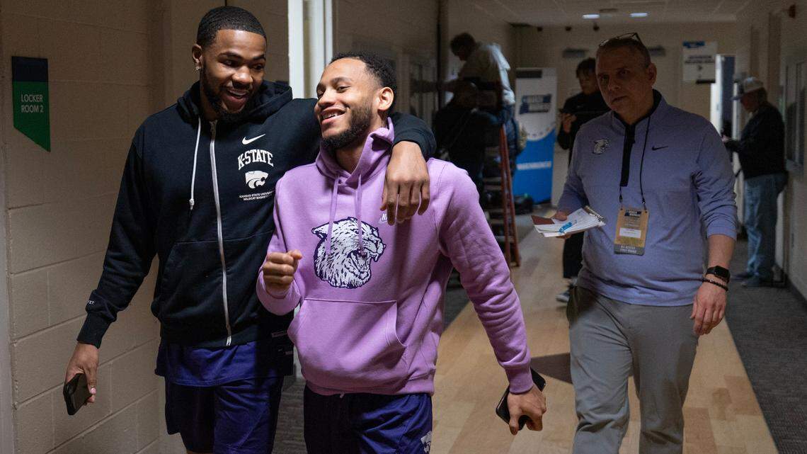 Kansas State’s Desi Sills, left, and Markquis Nowell head back to the locker room after talk with reporters at the Greensboro Coliseum on Thursday. Kansas State will take on Montana State in first round of the NCAA Tournament on Friday.