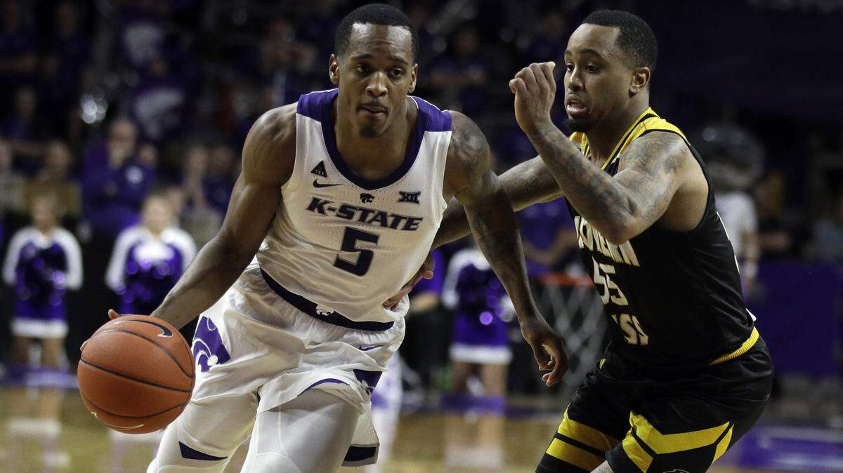 Kansas State guard Barry Brown Jr. (5) and Southern Mississippi guard Tyree Griffin (55) during the second half of an NCAA college basketball game in Manhattan, Kan., Wednesday, Dec. 19, 2018. (AP Photo/Orlin Wagner)