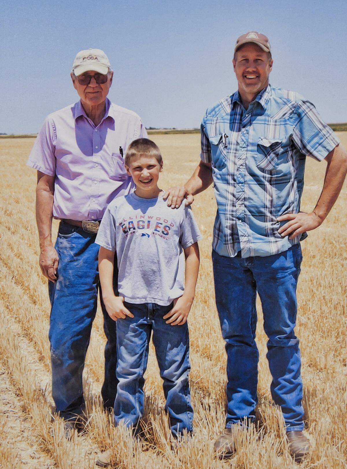 Three generations of family farming. Jack, James and Joe Schlessiger. This picture was taken by Dr. Dan Witt who had treated James years before for a serious illness.