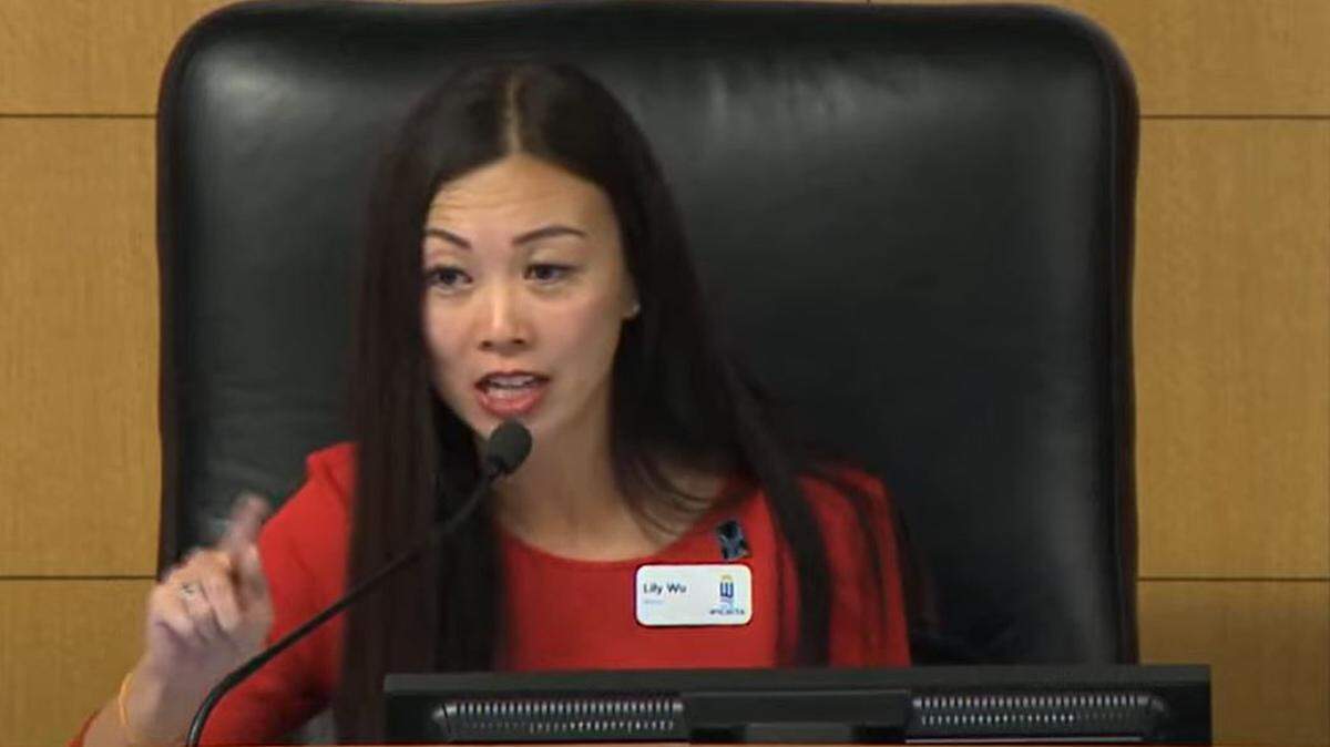 Wichita Mayor Lily Wu lectures state Sen. Mary Ware from the bench after Ware told the City Council “The last thing I could think of that would be helpful as far as parks are concerned . . . would be to lower the number. If anything, we need more parks.”