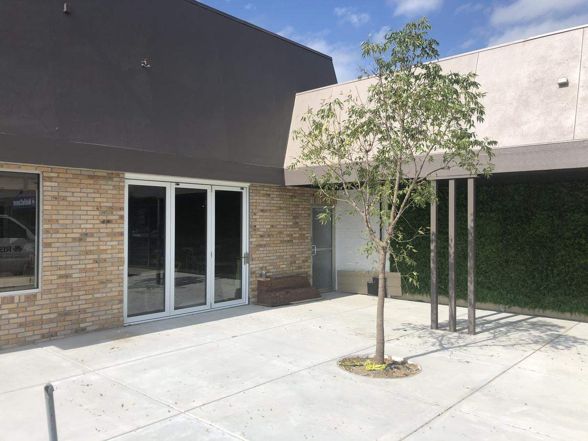 A new patio at the Meddys at Harry and Rock will have a backdrop of greenery and a metal enclosure.