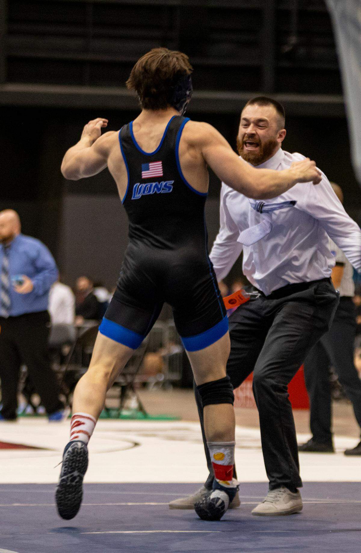 Goddard junior David Sample celebrates winning the 165-pound title at the Class 5A state wrestling tournament at Hartman Arena on Saturday.